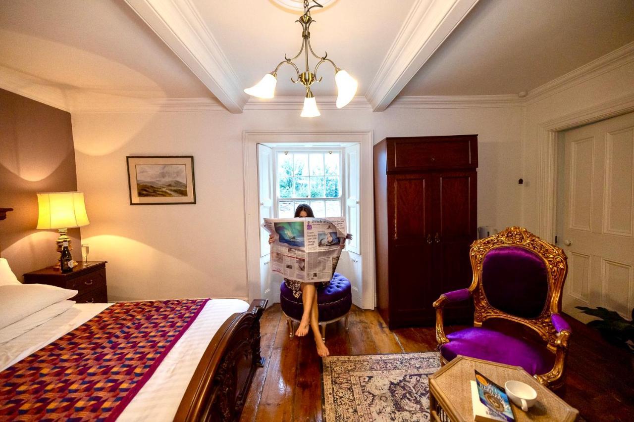 Clone Country House Aughrim Bagian luar foto A guest reading the Irish Times in the hotel