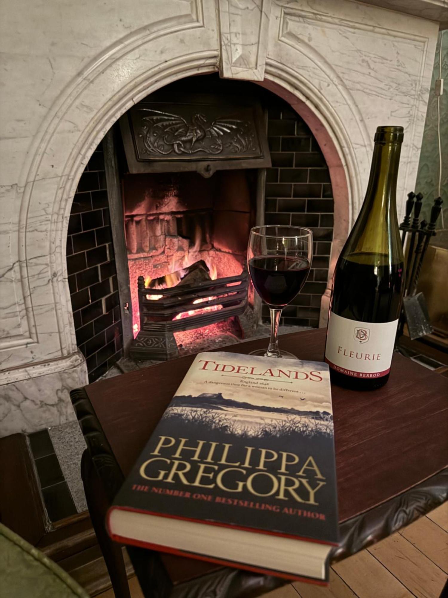 Clone Country House Aughrim Bagian luar foto A wine and book at the fireplace